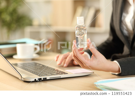 Entrepreneur hands using laptop showing sanitizer rub Entrepreneur hands using laptop showing sanitizer rub 119551423
