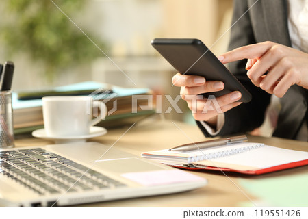 Entrepreneur hands with agenda using phone 119551426