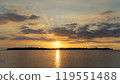 the sun is setting over a small island in the middle of the ocean 119551488