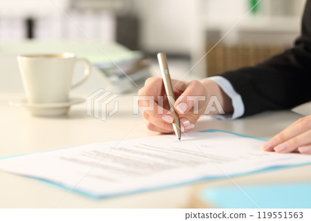 Executive woman hands signing contract at work 119551563