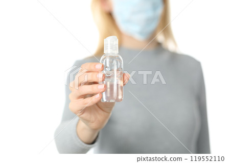 Woman with mask showing hand sanitizer isolated on white Woman with mask showing hand sanitizer isolated on white 119552110
