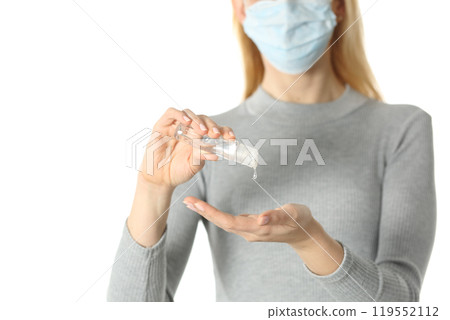 Woman with mask using hand sanitizer isolated on white 119552112
