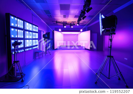 Modern studio showcasing vibrant purple lighting with equipment set up for a creative project in an 119552207