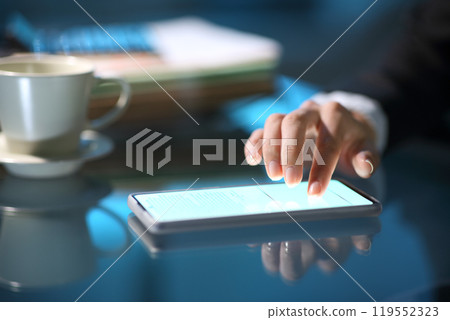 Businesswoman hand signing online on smart phone in the night 119552323