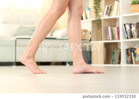 Close up of woman legs walking at home Close up of woman legs walking at home 119552330