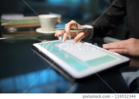 Executive hand using tablet in the night at office Executive hand using tablet in the night at office 119552344