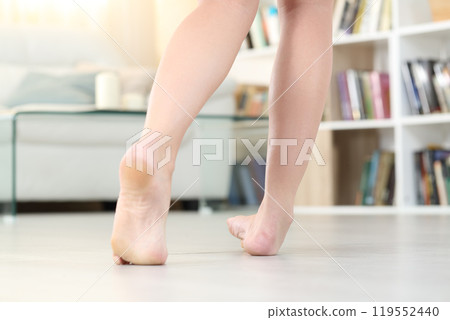 Woman legs spraining ankle at home 119552440
