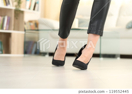 Woman legs with high heels walk and sprain ankle Woman legs with high heels walk and sprain ankle 119552445