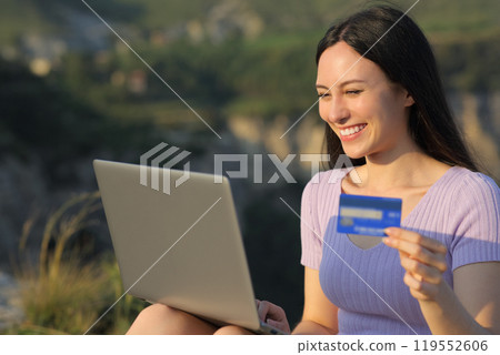 Asian woman buying online in the mountain 119552606