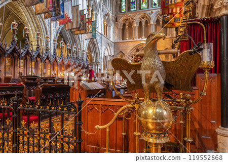 Gilded eagle lectern in St. Patrick's Cathedral Dublin with gothic arched ceilings 119552868