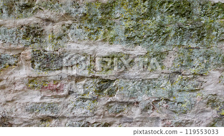 Textured Stone Wall With Moss and Lichen in Natural Setting During Daylight Textured Stone Wall With Moss and Lichen in Natural Setting During Daylight 119553033