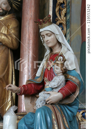 Virgin Mary with baby Jesus, statue on the altar of Saints Cyril and Methodius in Church of Birth of Virgin Mary in Svetice, Croatia 119553242