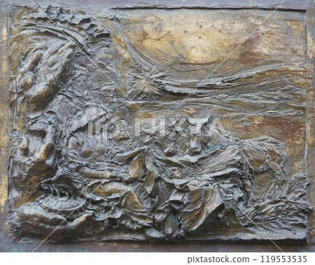 Birth of Jesus Christ, detail on the door of the church of St. James the Greater in Porto Azzurro, Elba, Italy Birth of Jesus Christ, detail on the door of the church of St. James the Greater in Porto Azzurro, Elba, Italy 119553535