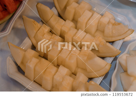 Sliced Melon Display on Elegant Serving Plate 119553672