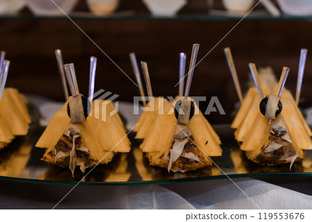 Creative Fruit Presentation of Pineapple Moth Snacks at a Culinary Event 119553676