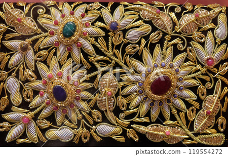 Handmade embroidered pillows on display at souvenir shop in Agra, Uttar Pradesh, India 119554272