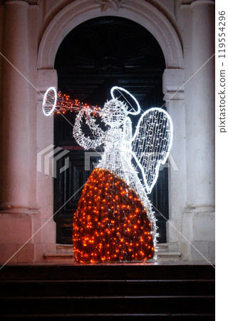 Christmas angel decorated with lights and ornaments, shining in the romantic atmosphere, Dubrovnik, Croatia 119554296