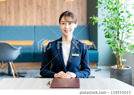 Female consultant at reception Female consultant at reception 119555015