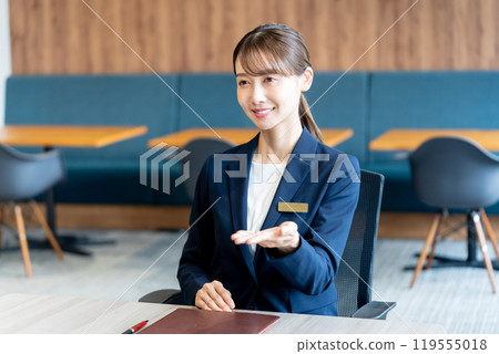 Female consultant at reception Female consultant at reception 119555018