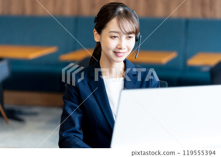 Female operator working in the office Female operator working in the office 119555394