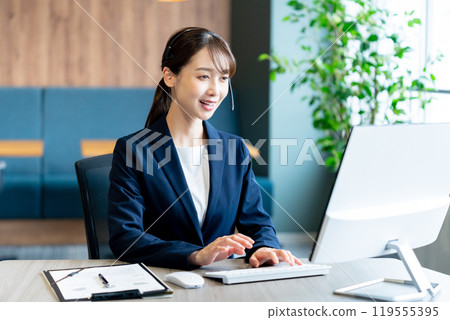 Female operator working in the office 119555395