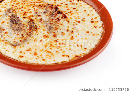 Delicious lasagna with meat and cheese baking in rustic clay plate 119555756