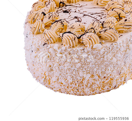 Delicious cake decorated with white chocolate shavings and buttercream piping 119555936