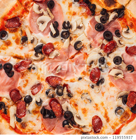 Delicious pizza closeup with melted cheese, salami, mushrooms and black olives Delicious pizza closeup with melted cheese, salami, mushrooms and black olives 119555937