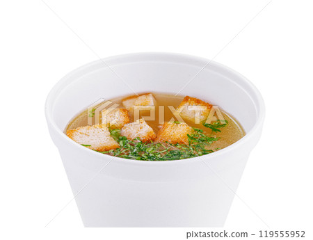 Delicious broth with croutons in a white bowl on white background 119555952