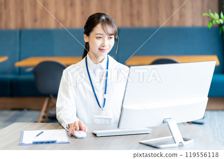 A medical professional operator wearing a white coat 119556118