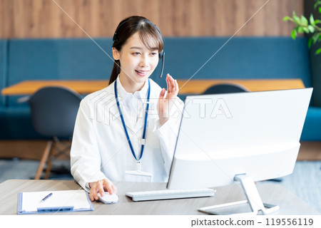 A medical professional operator wearing a white coat A medical professional operator wearing a white coat 119556119