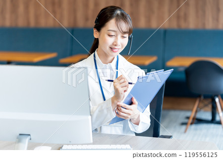 A medical professional operator wearing a white coat A medical professional operator wearing a white coat 119556125