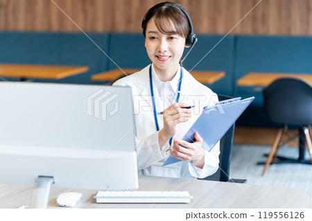 A medical professional operator wearing a white coat 119556126