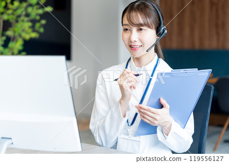 A medical professional operator wearing a white coat A medical professional operator wearing a white coat 119556127