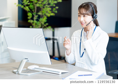 A medical professional operator wearing a white coat A medical professional operator wearing a white coat 119556130