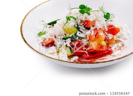 Shopska salad served on white plate with microgreens decoration 119556347