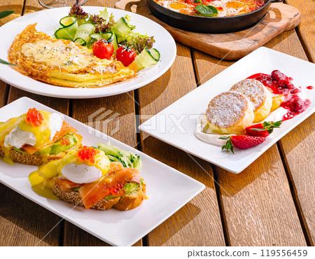 omelet with salad and cottage cheese pancakes and avocado toast and eggs benedict 119556459