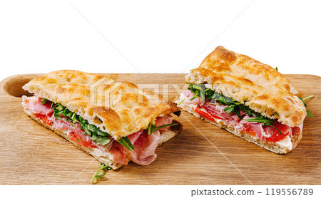 Fresh italian panini sandwich on wooden board Fresh italian panini sandwich on wooden board 119556789