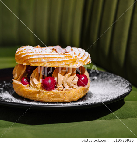 Gourmet paris-brest pastry on elegant plate 119556936
