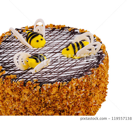 Round honey cake is decorated with edible bees and chocolate lines 119557138