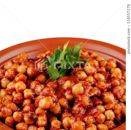 Clay plate presenting chickpeas with tomato sauce garnished with parsley 119557278