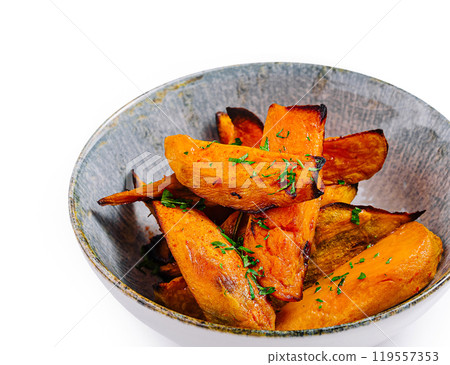 Baked sweet potato fries being served in bowl 119557353