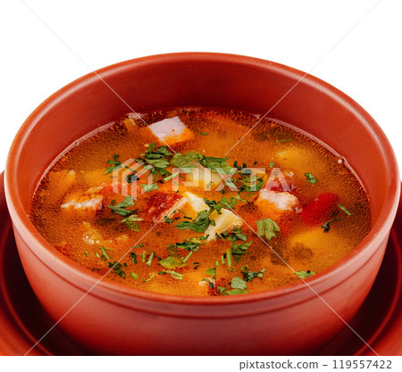 Fresh hot soup with meat and vegetables served in brown bowl 119557422