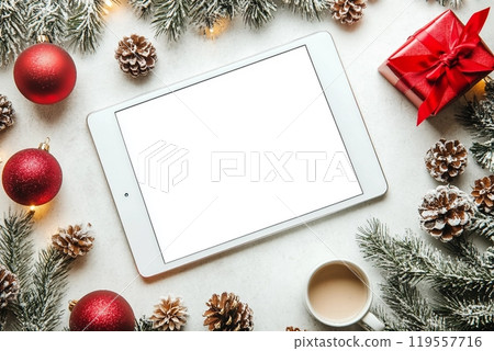 Christmas decorations and tablet on white concrete background. Christmas and New Year theme. Flat lay, top view, space for text Christmas decorations and tablet on white concrete background. Christmas and New Year theme. Flat lay, top view, space for text 119557716