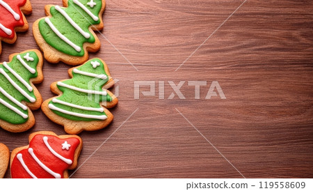 Christmas tree shaped gingerbread cookies on wooden background with copy space Christmas tree shaped gingerbread cookies on wooden background with copy space 119558609