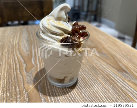 Delicious soft serve ice cream on a wooden table 119559551