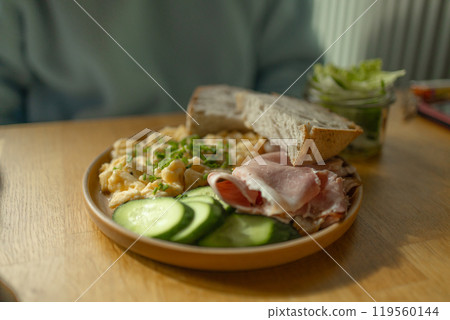 Delicious sandwiches with eggs, ham and cucumbers served on buffet table for brunch Delicious sandwiches with eggs, ham and cucumbers served on buffet table for brunch 119560144