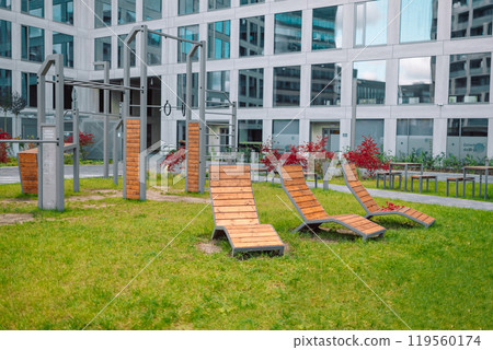 Outdoor exercise equipment in the park. The sports ground. Outdoor fitness equipment in public park. Gym for street workout. Outdoor sports complex for training. Healthy lifestyle. Outdoor exercise equipment in the park. The sports ground. Outdoor fitness equipment in public park. Gym for street workout. Outdoor sports complex for training. Healthy lifestyle. 119560174