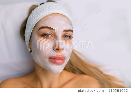 facial rejuvenation treatment with cream at the spa 119561032
