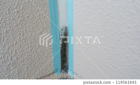 Exterior wall construction | Image of caulking work in progress 119561691